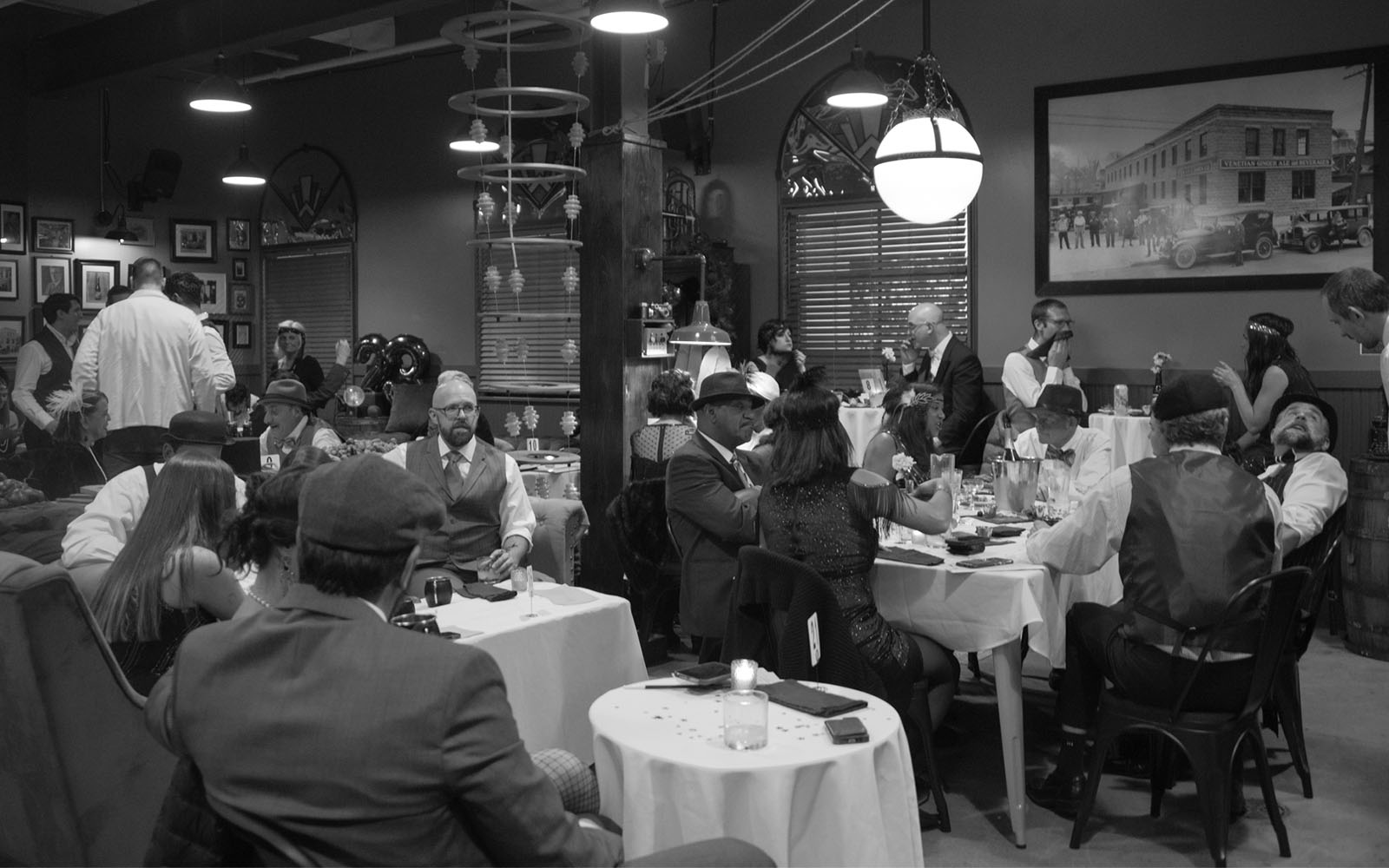 Photo · full room, lights low, bar lit